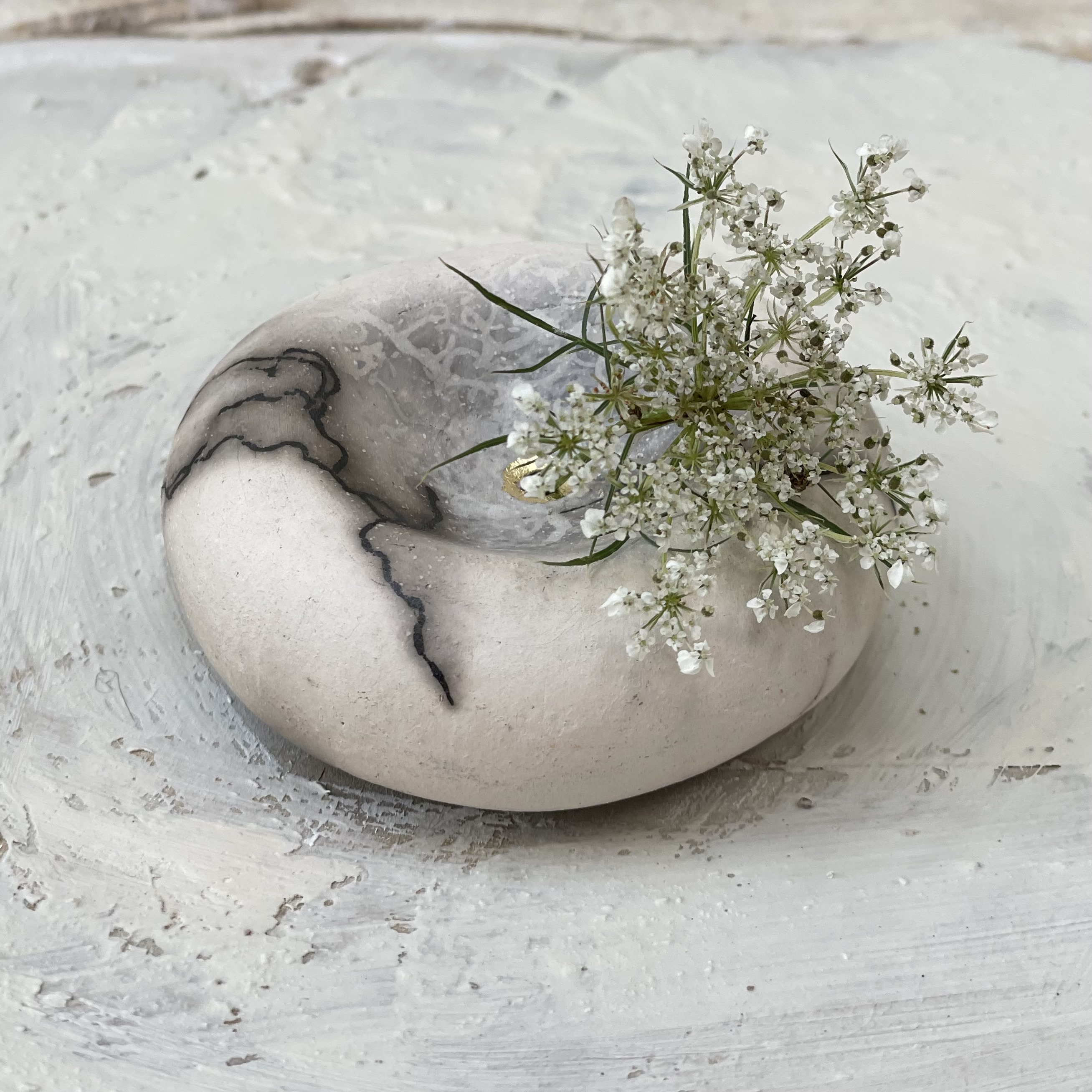 concave pebble pot ... horsehair raku